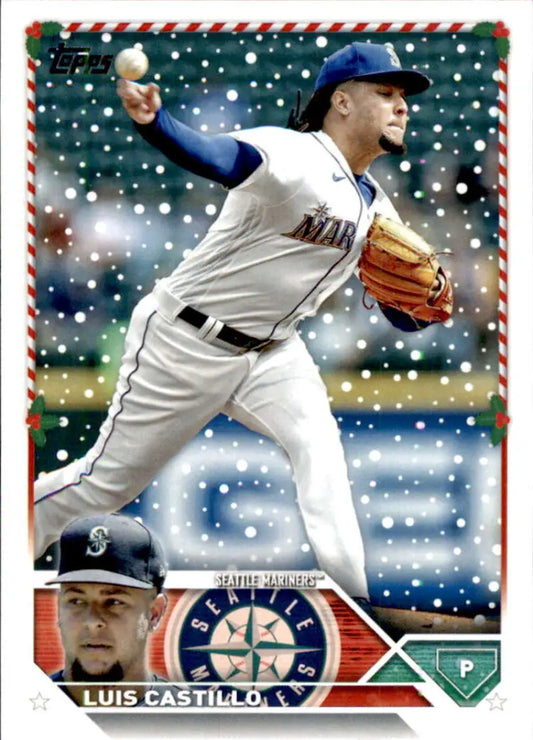 Baseball player in Seattle Mariners uniform mid-pitch during snowfall on Topps Holiday card