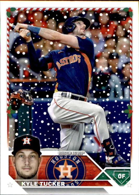 Baseball card featuring Kyle Tucker in navy uniform swinging bat for the Astros