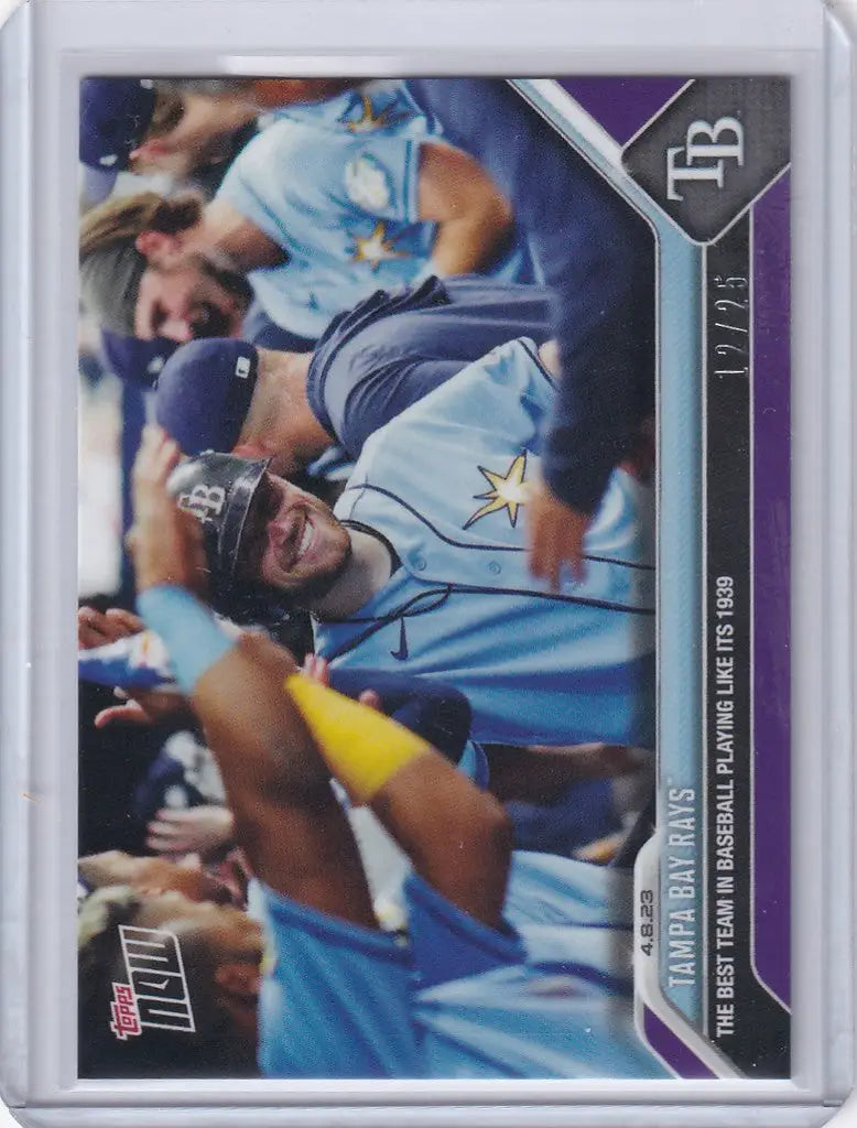 Baseball trading card of Tampa Bay Rays celebrating players in light blue uniforms