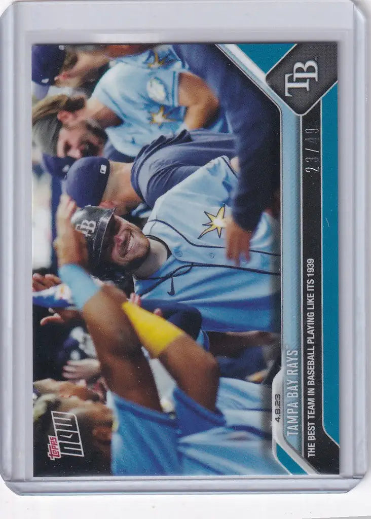 Baseball trading card of Tampa Bay Rays player in light blue celebrating enthusiastically