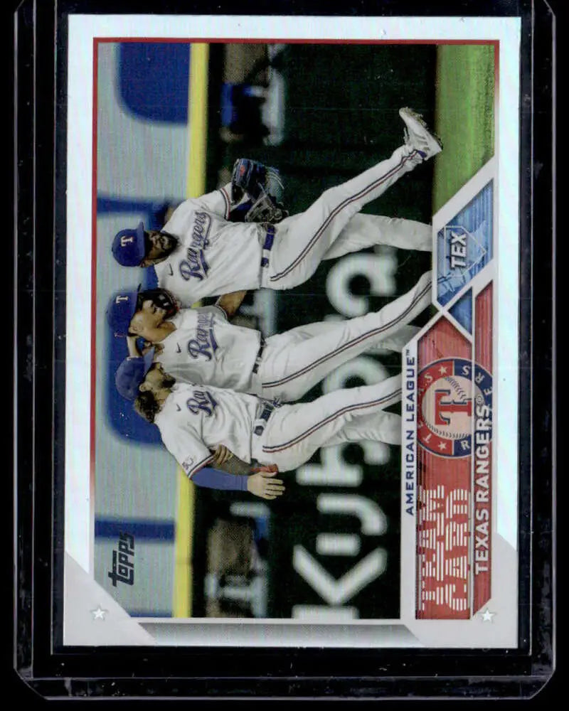 Texas Rangers players celebrating in white uniforms on 2023 Topps Rainbow Foil card