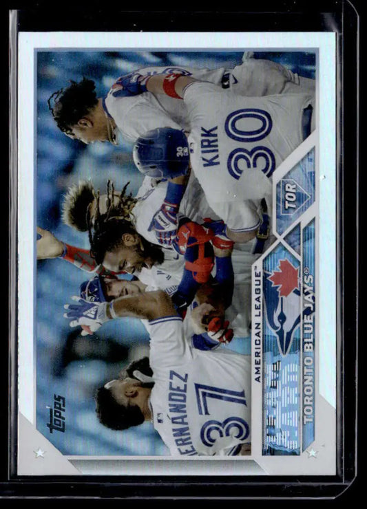 Baseball card of Toronto Blue Jays players celebrating in 2023 Topps Rainbow Foil design