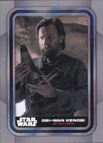 Star Wars trading card featuring Obi-Wan Kenobi in dark robes examining an object