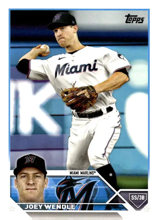 Miami Marlins Joey Wendle baseball card in white uniform making throwing motion