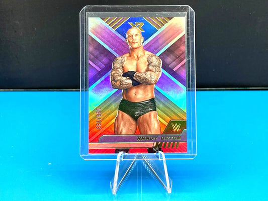 Holographic WWE Chronicles trading card of Randy Orton displayed on a stand