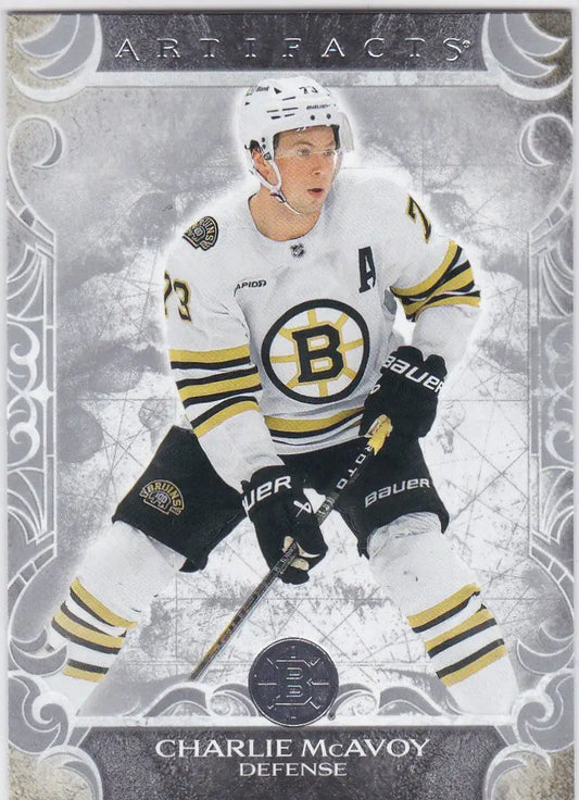 Hockey player in white Boston Bruins jersey number 73 from Upper Deck Artifacts