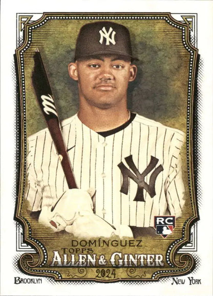 Baseball card of Jasson Dominguez in New York Yankees pinstripe uniform with bat