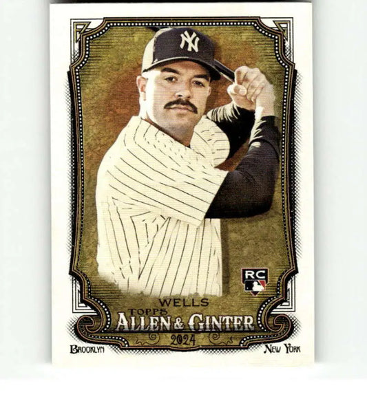 Baseball card of Austin Wells in Yankees pinstripes with a mustache