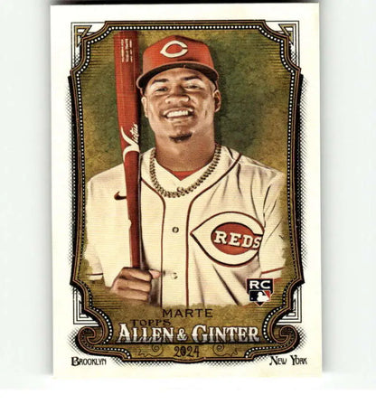 Noelvi Marte Rookie Cincinnati Reds baseball card with player in home uniform holding bat