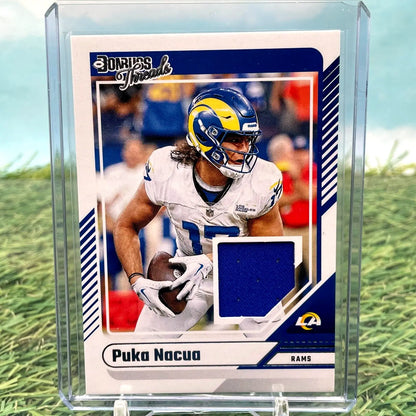 Football trading card featuring Puka Nacua with blue jersey patch from Panini Donruss