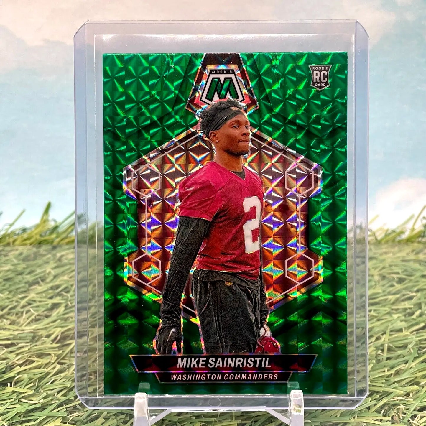 Green Mosaic Prizm rookie card of Mike Sainristil in Washington Commanders jersey