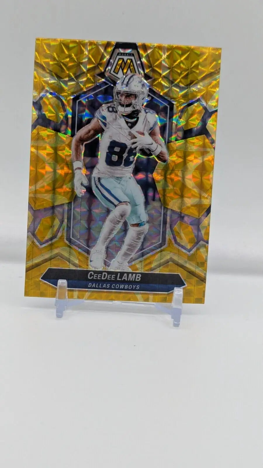 2024 Panini Mosaic CeeDee Lamb Mosaic Reactive Yellow Prizm football card for Cowboys