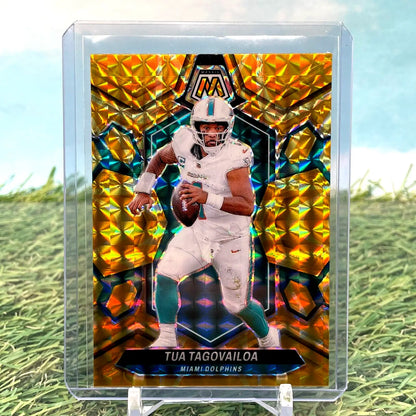 Gold mosaic-patterned Panini Mosaic trading card of Tua Tagovailoa in Dolphins uniform