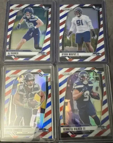 Four football trading cards from the 2024 Panini Prizm Red, White, & Blue Prizm Seahawks