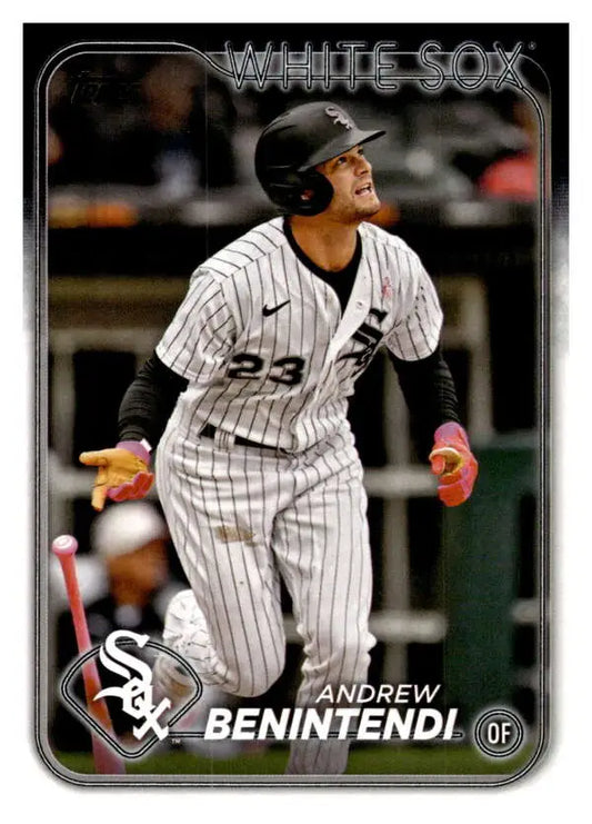 Andrew Benintendi swinging a bat in Chicago White Sox pinstriped uniform