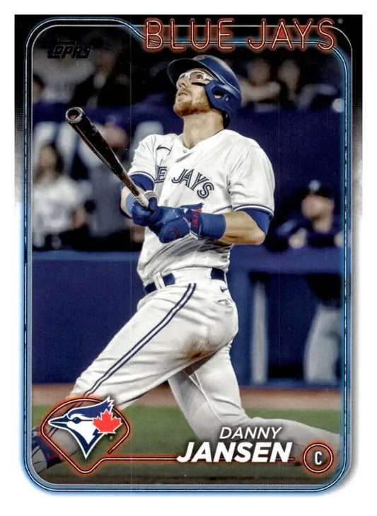 Toronto Blue Jays player Danny Jansen swinging bat in white home uniform for card