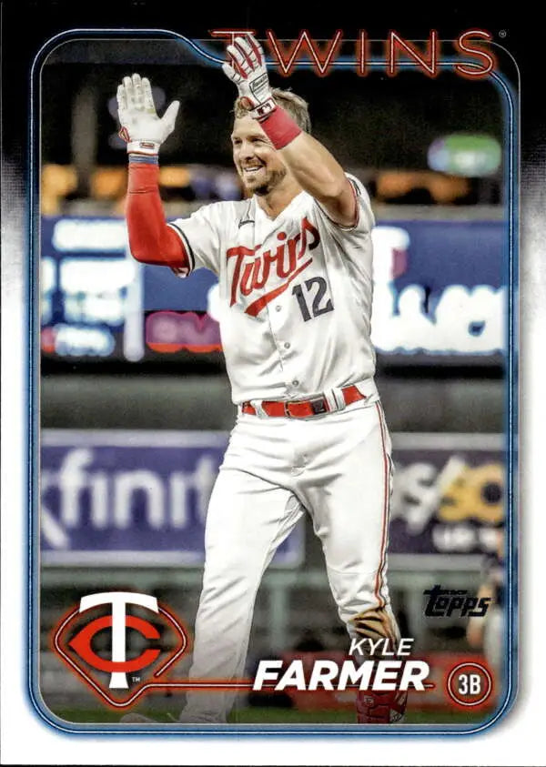 Baseball card of Kyle Farmer in white Minnesota Twins uniform raising his arm