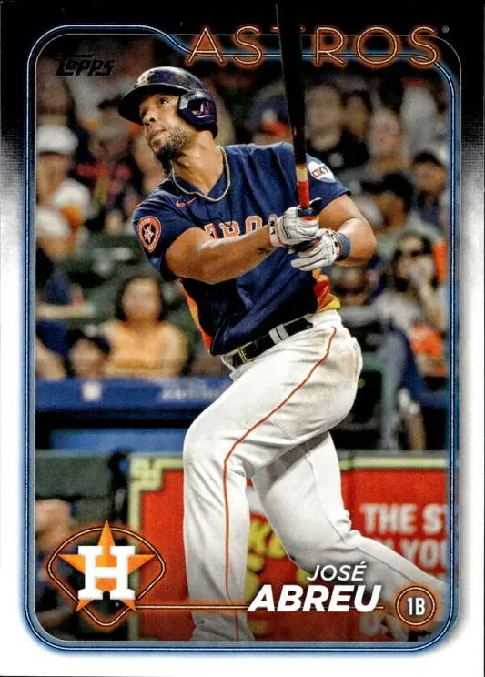 Jose Abreu swinging bat in a Houston Astros navy jersey baseball card