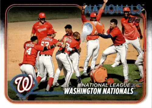 Baseball team celebrating with 2024 Topps Team Card featuring Simply Sandoval