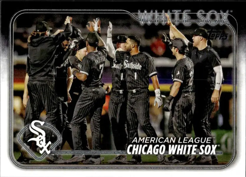 Baseball team celebrating in black Chicago White Sox uniforms on baseball card