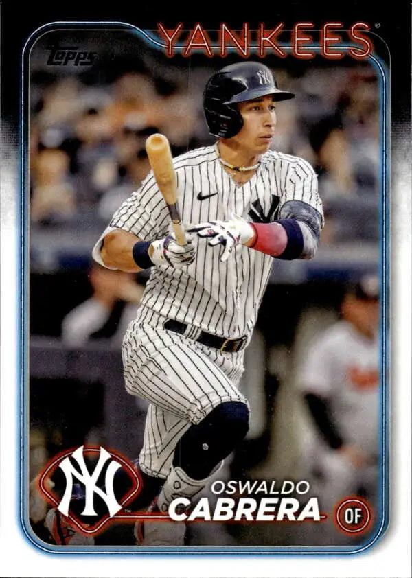 Oswaldo Cabrera batting in pinstripe uniform on 2024 Topps Yankees baseball card