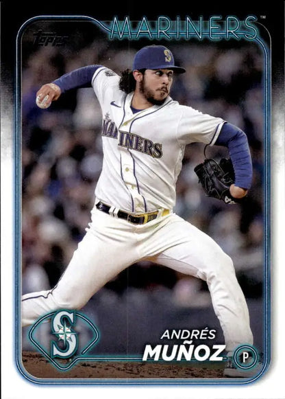 Seattle Mariners pitcher Andres Munoz in mid-throwing motion in white home uniform