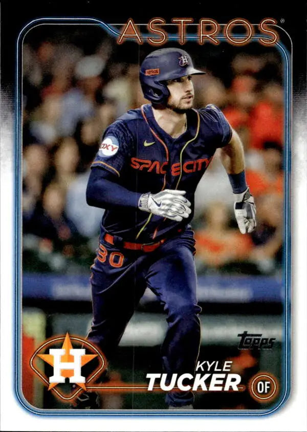 Baseball card of Kyle Tucker in navy blue Houston Astros uniform with orange accents