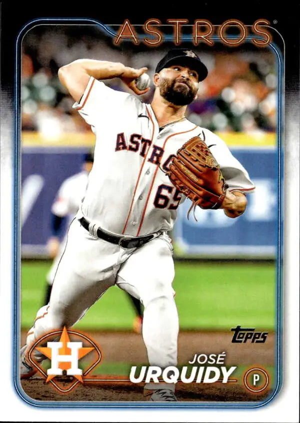 Jose Urquidy delivering a pitch in a white Houston Astros uniform on a baseball card