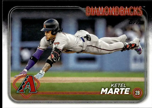 Baseball player Ketel Marte diving in Arizona Diamondbacks uniform for baseball card