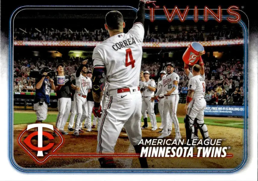 Minnesota Twins player wearing number 4 celebrates with teammates on baseball field