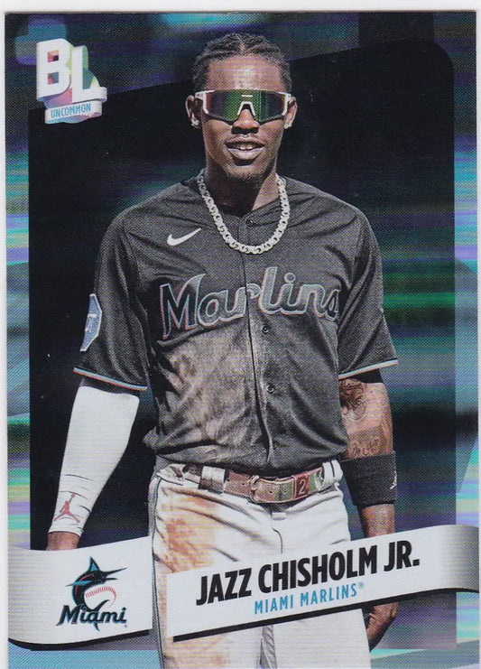 Baseball player in Miami Marlins jersey and sunglasses featuring Topps Big League Chisolm Jr Rainbow