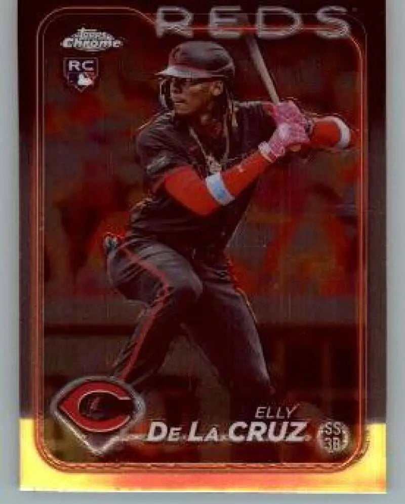 Baseball card of Elly De La Cruz in black uniform for Cincinnati Reds Topps Chrome Rookie