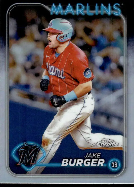 Baseball card of Jake Burger running the bases for Miami Marlins in orange jersey