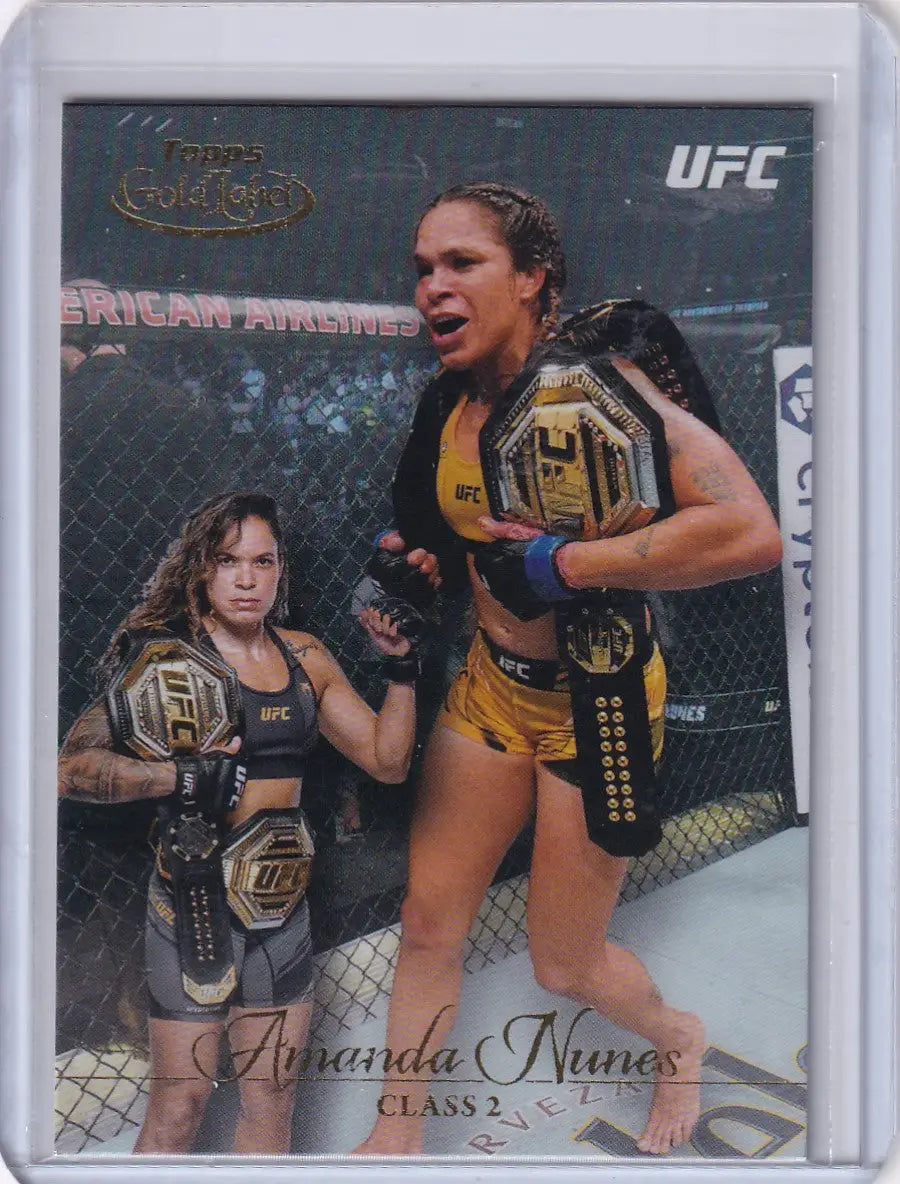 UFC trading card of Amanda Nunes celebrating with championship belts in Topps Gold Label