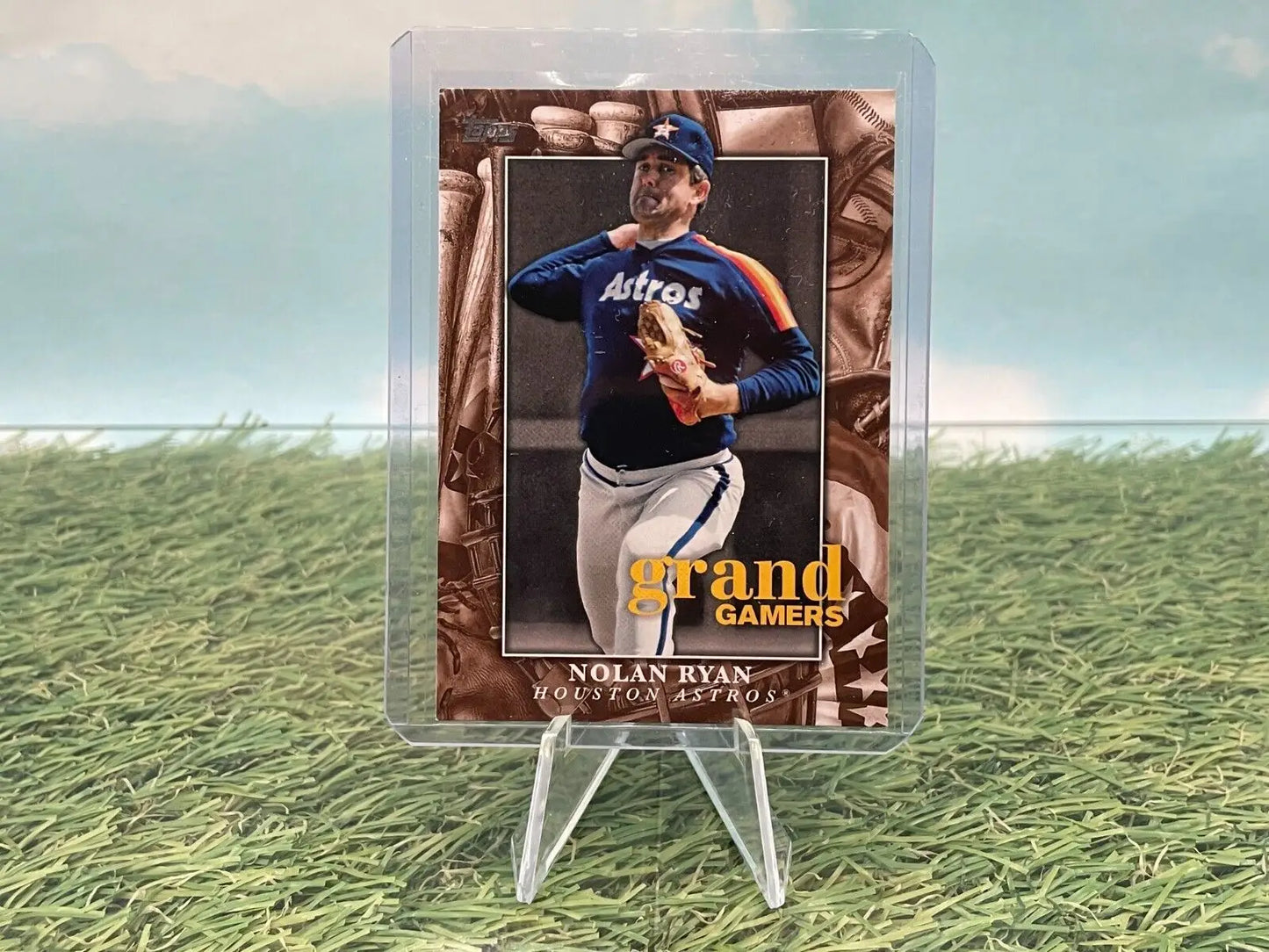 Baseball card of Nolan Ryan in navy Astros uniform from Topps Series 1 displayed securely