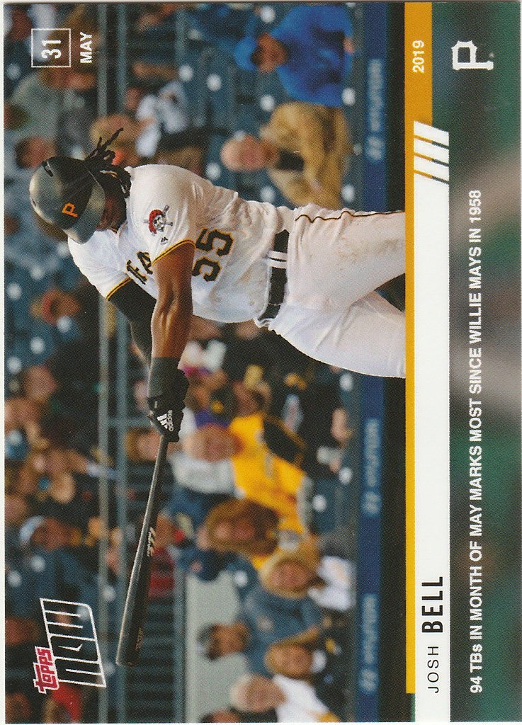 Baseball player Josh Bell in white uniform swinging bat for Pittsburgh Pirates game action