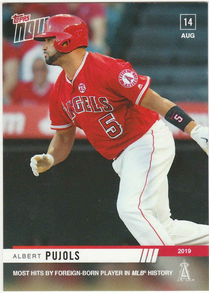 Baseball player in red Angels uniform swinging bat for Los Angeles Angels memorabilia