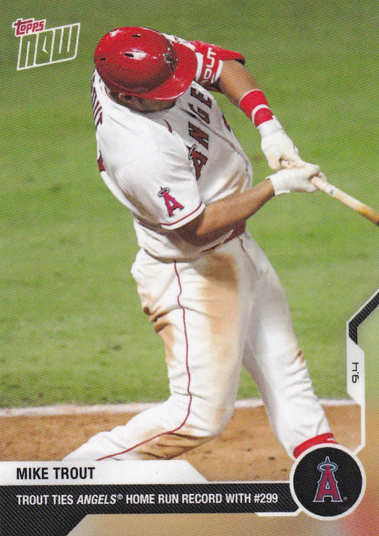 Baseball player in a white uniform swinging bat showcasing Mike Trout Los Angeles Angels