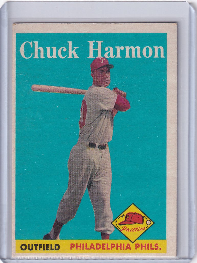 Vintage baseball card of Chuck Harmon in batting stance for the Philadelphia Phillies