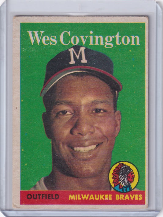 Wes Covington smiles on this 1958 Topps Milwaukee Braves trading card against green