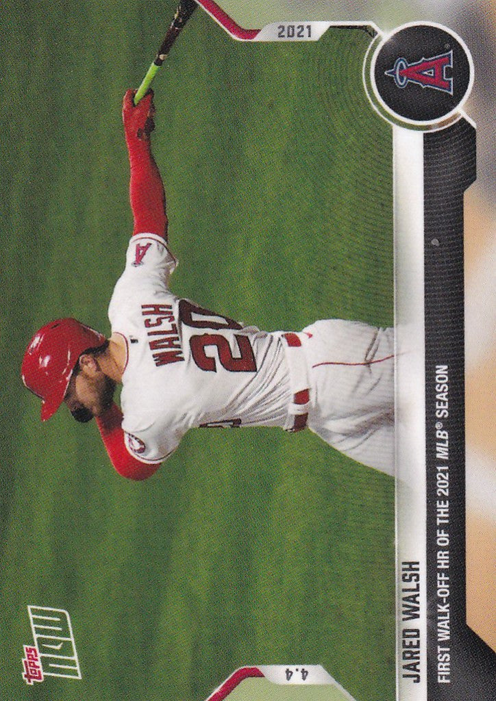 Jared Walsh sliding on grass in white and red uniform for Angels walk-off homerun