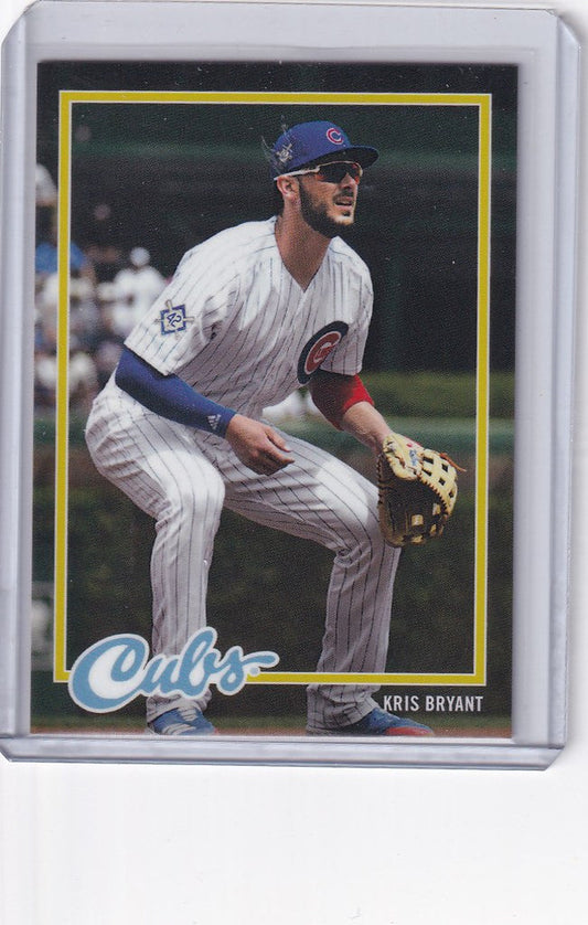 Baseball card of Kris Bryant Chicago Cubs in fielding stance with white and blue uniform