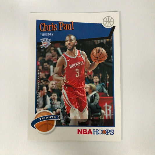 Chris Paul dribbling in red uniform on NBA Hoops trading card for Oklahoma City Thunder