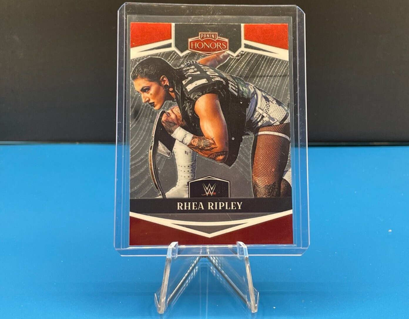 WWE 2023 Panini Chronicles Rhea Ripley Panini Honors card in clear display stand