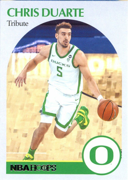 Basketball player in white Oregon Ducks uniform dribbling ball, Panini Chronicles Hoops Draft