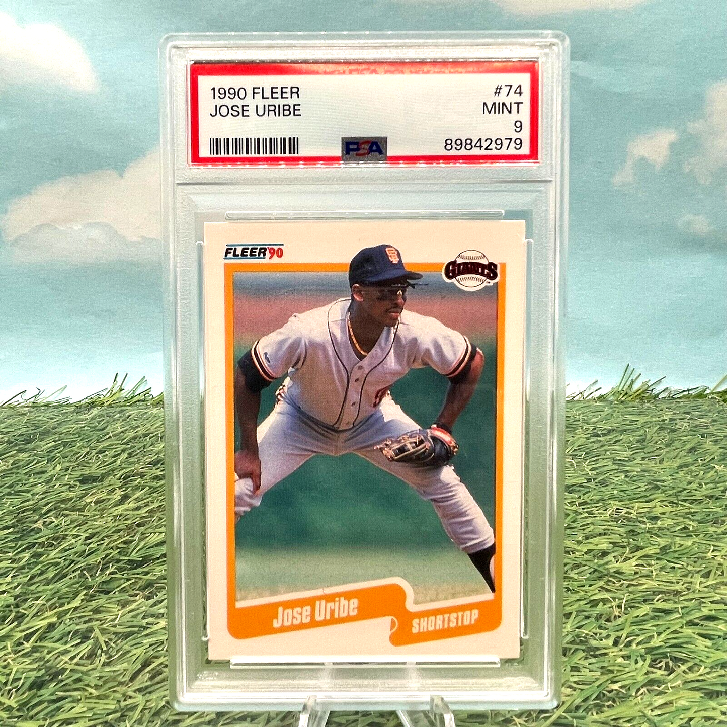 PSA-graded 1990 Fleer baseball card of Jose Uribe in fielding position with rare birth date error