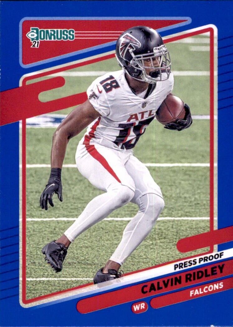 Football player in white Atlanta Falcons uniform running with ball for Donruss Calvin Ridley