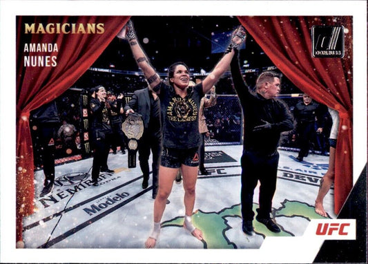 Victorious UFC fighter celebrating in octagon on 2022 Panini Donruss UFC Magicians card