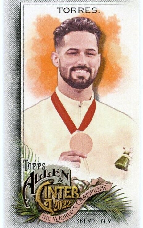 Trading card of Ariel Torres Mini in white jersey with medal on orange background