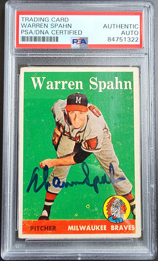 PSA DNA auto 1958 Topps Warren Spahn card with autographed pitching pose on green background